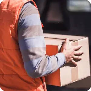 A delivery driver handles a package, ready to use a mobile app to complete a digital delivery form for instant proof of delivery and confirmation.