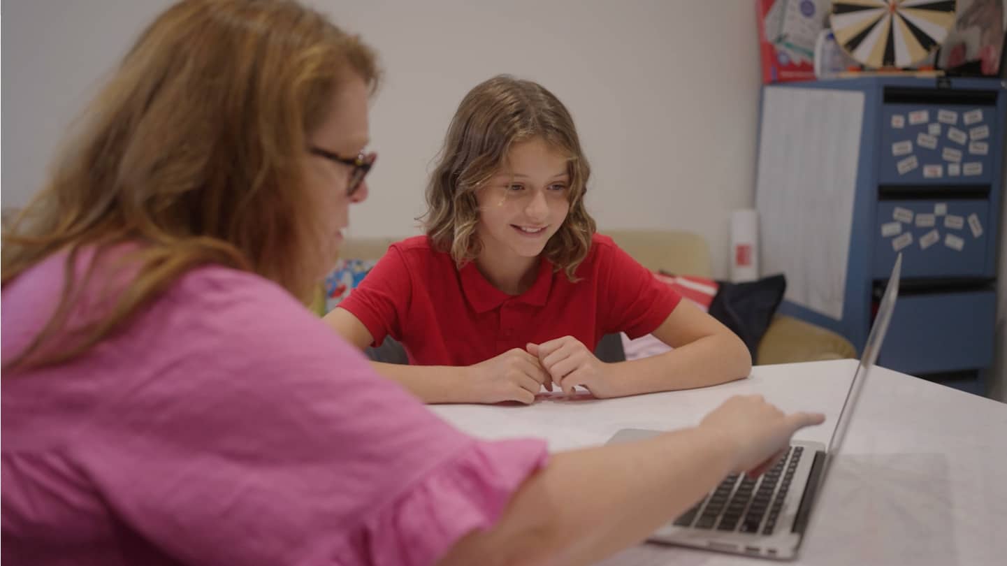 Educator sharing reading report with student