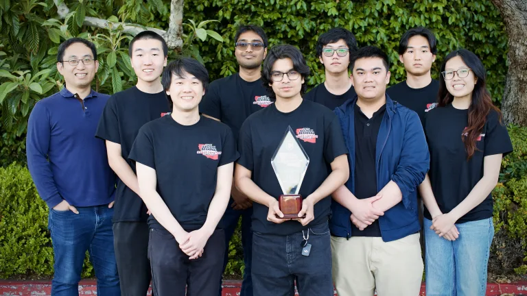 UC Irvine team holding the Alamo Cup trophy after winning the 20th Annual National Collegiate Cyber Defense Competition